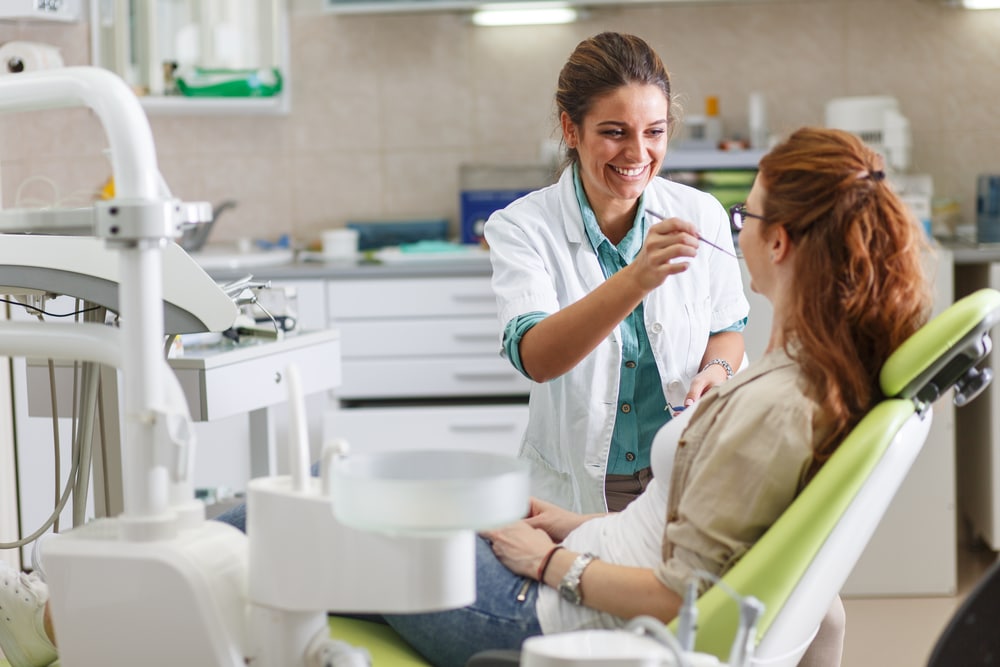 Holistic dentist working on patient