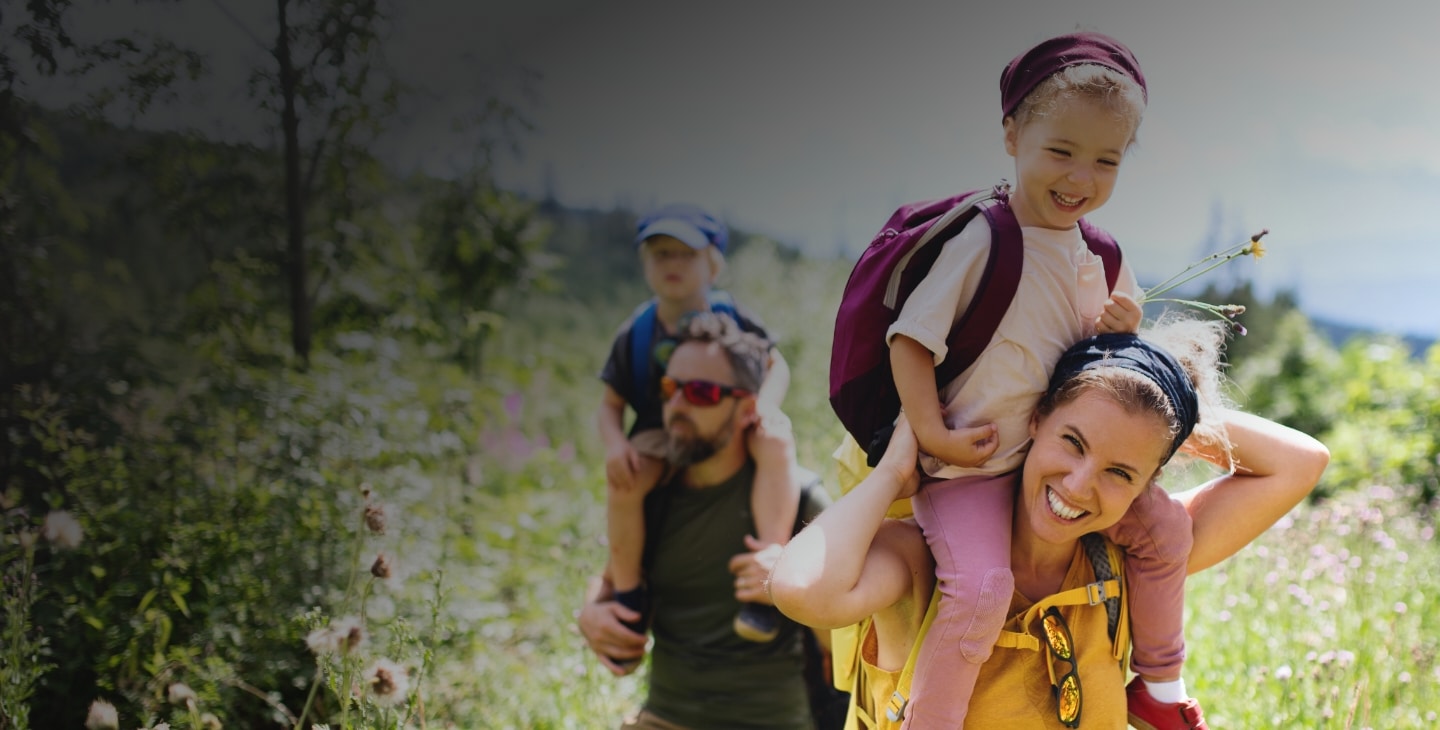 Happy family with beautiful smiles from holistic, integrative dentistry