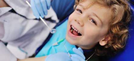 Child at the dentist getting his teeth preserved