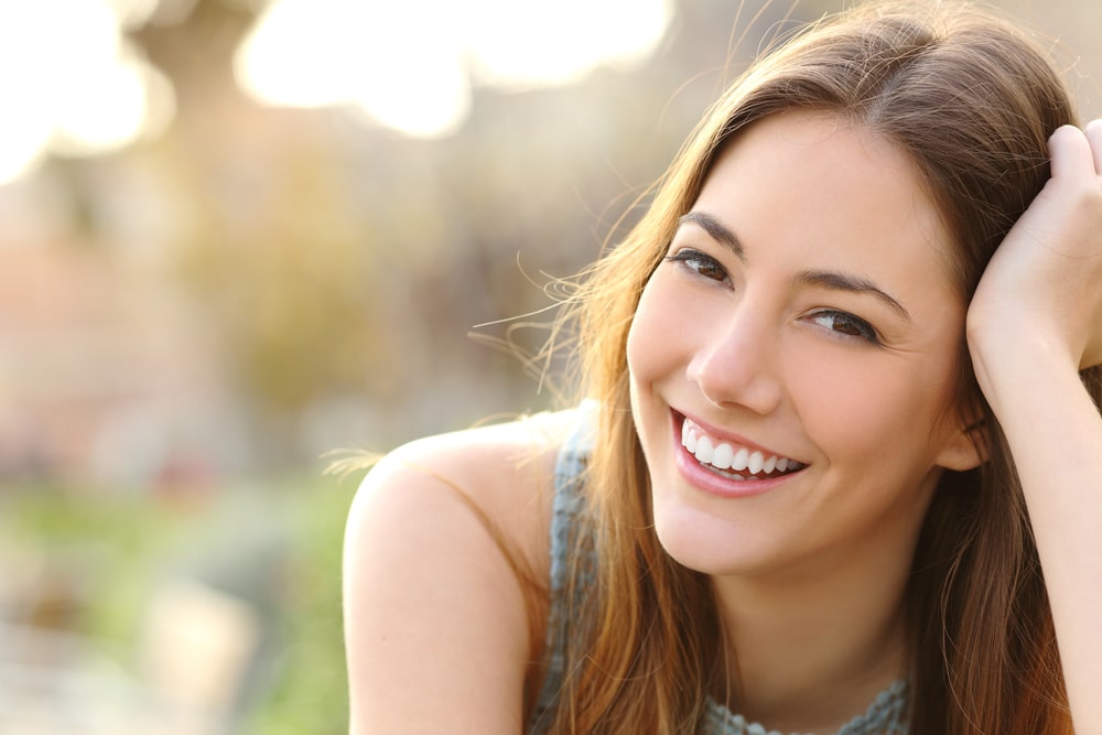 Woman with healthy teeth smiling