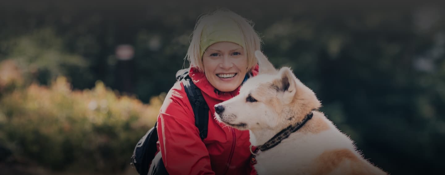 Woman enjoying the Alaskan outdoors and smiling with beautiful teeth 